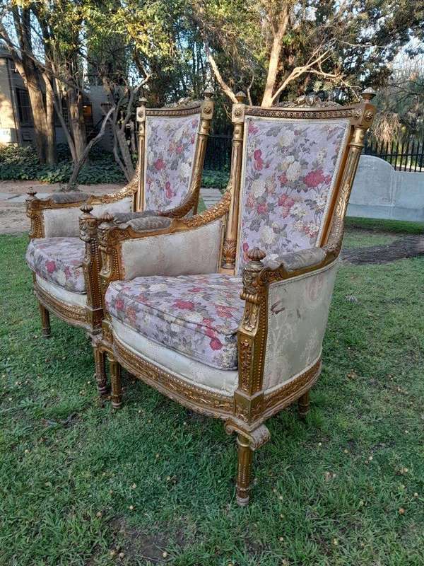 A 20th Century Pair of French Style Bergere Hand Gilded Wooden Armchairs
