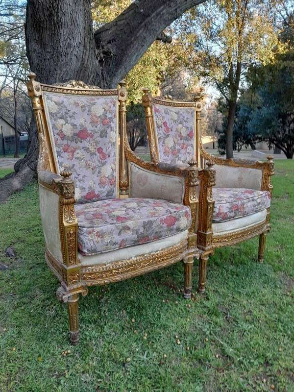 A 20th Century Pair of French Style Bergere Hand Gilded Wooden Armchairs