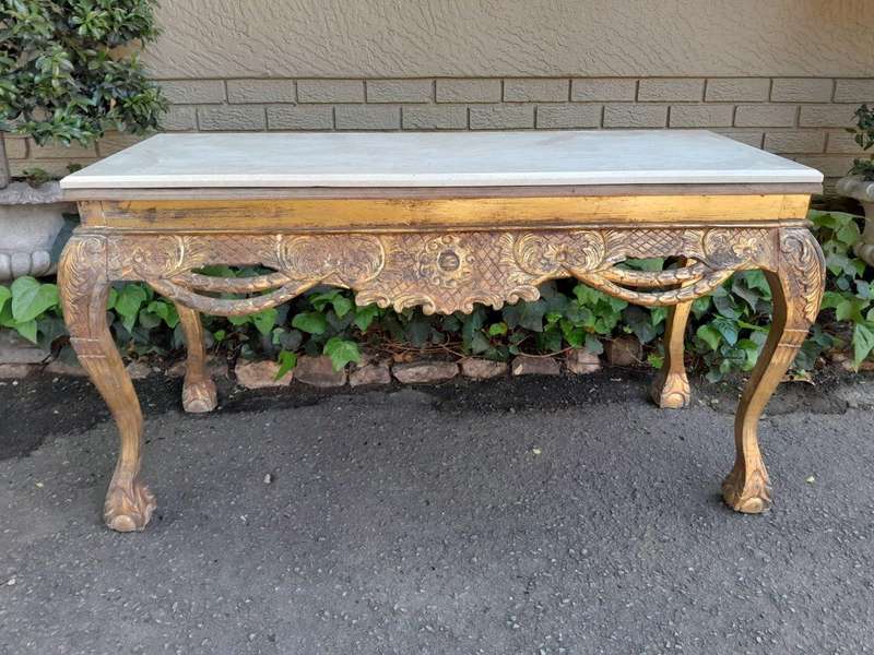 A 20th Century Ornately Carved Server/ Console/Entrance Hall Table with a Marble Top