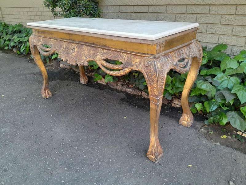 A 20th Century Ornately Carved Server/ Console/Entrance Hall Table with a Marble Top