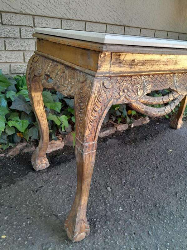 A 20th Century Ornately Carved Server/ Console/Entrance Hall Table with a Marble Top