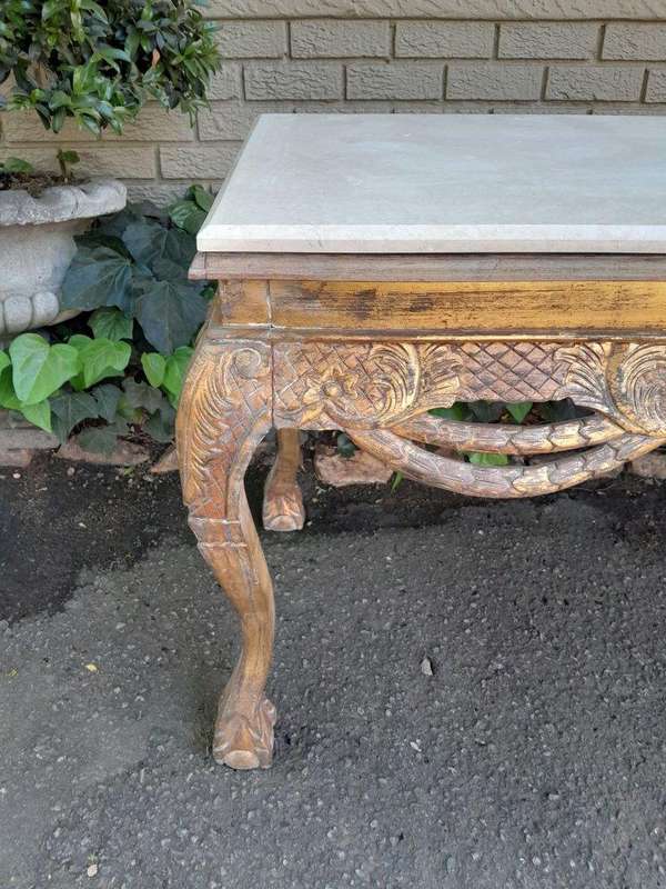 A 20th Century Ornately Carved Server/ Console/Entrance Hall Table with a Marble Top