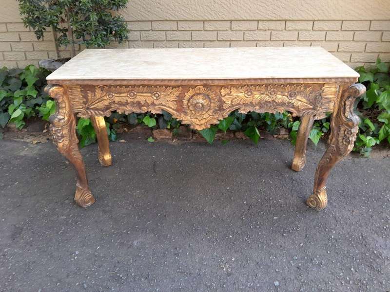 A 20th Century Ornately Carved Server/ Console/Entrance Hall Table with a Marble Top