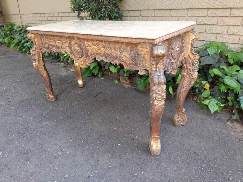 A 20th Century Ornately Carved Server/ Console/Entrance Hall Table with a Marble Top