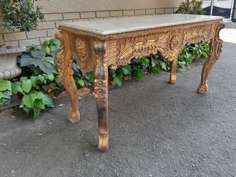 A 20th Century Ornately Carved Server/ Console/Entrance Hall Table with a Marble Top