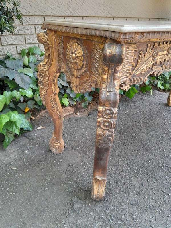 A 20th Century Ornately Carved Server/ Console/Entrance Hall Table with a Marble Top
