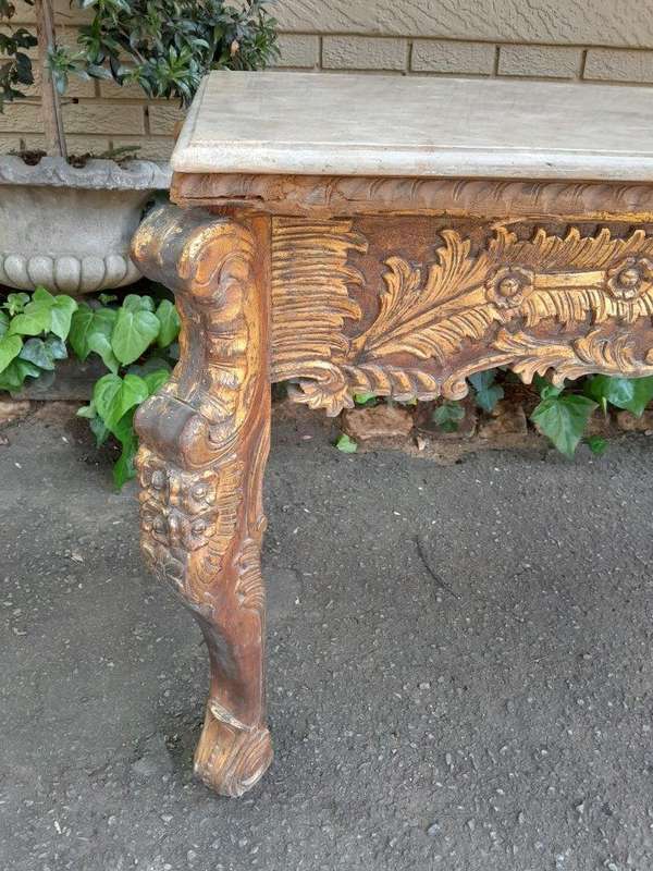 A 20th Century Ornately Carved Server/ Console/Entrance Hall Table with a Marble Top