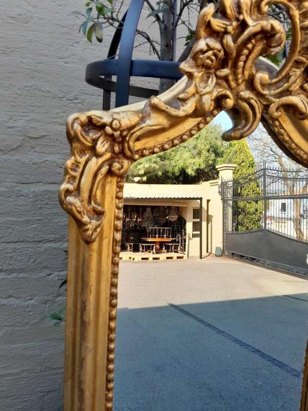 An Ornate Rococo French Style Carved Bevelled Mirror