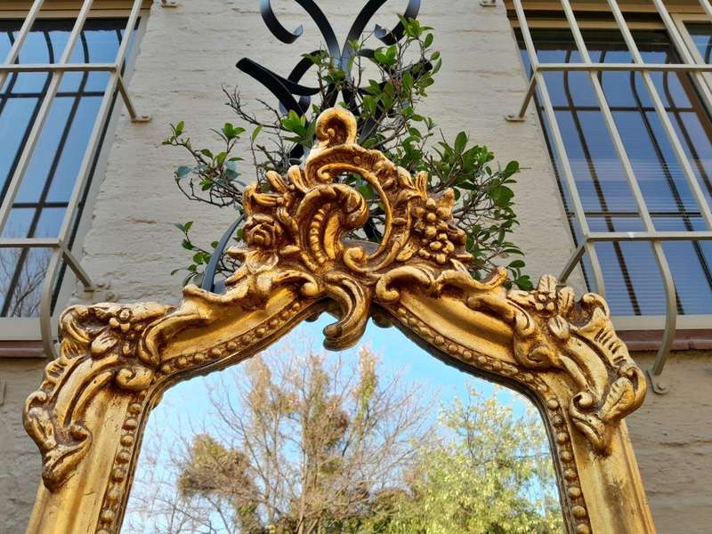 An Ornate Rococo French Style Carved Bevelled Mirror