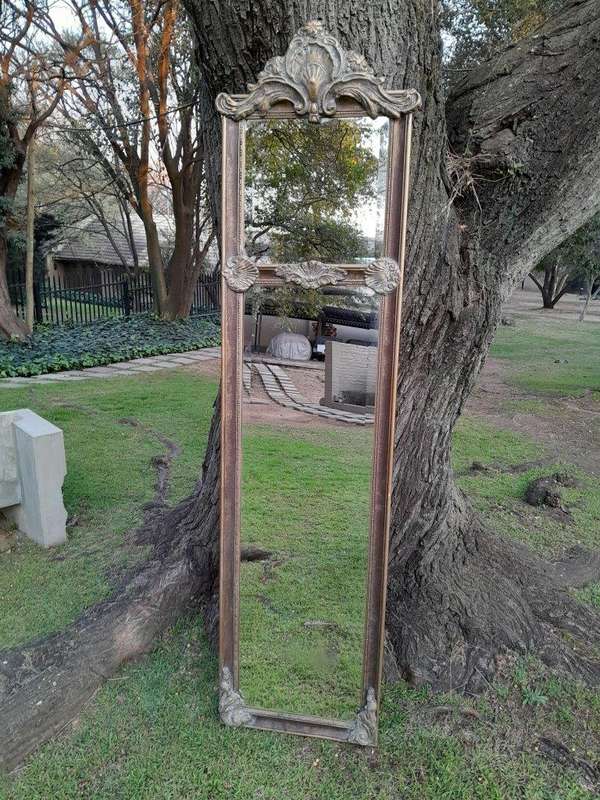 An Ornate Carved Rococo French Style Bevelled Mirror