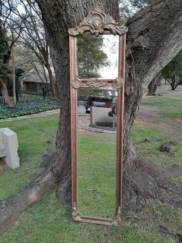 An Ornate Carved Rococo French Style Bevelled Mirror