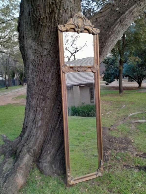 An Ornate Carved Rococo French Style Bevelled Mirror