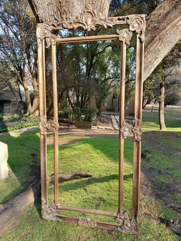 An Ornate Carved Rococo French Style Bevelled Mirror