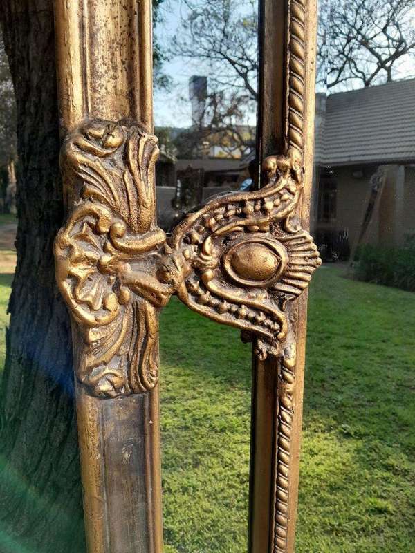 An Ornate Carved Rococo French Style Bevelled Mirror