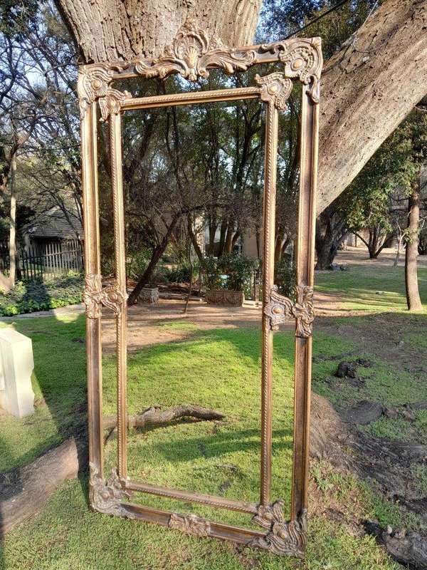 An Ornate Carved Rococo French Style Bevelled Mirror