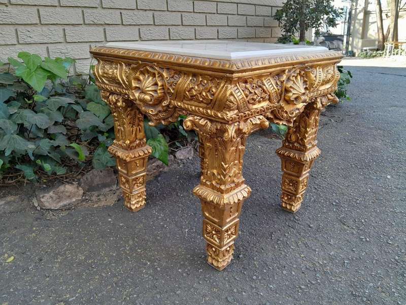 A 20th Century French Style Ornately Carved Side Table with Marble Top