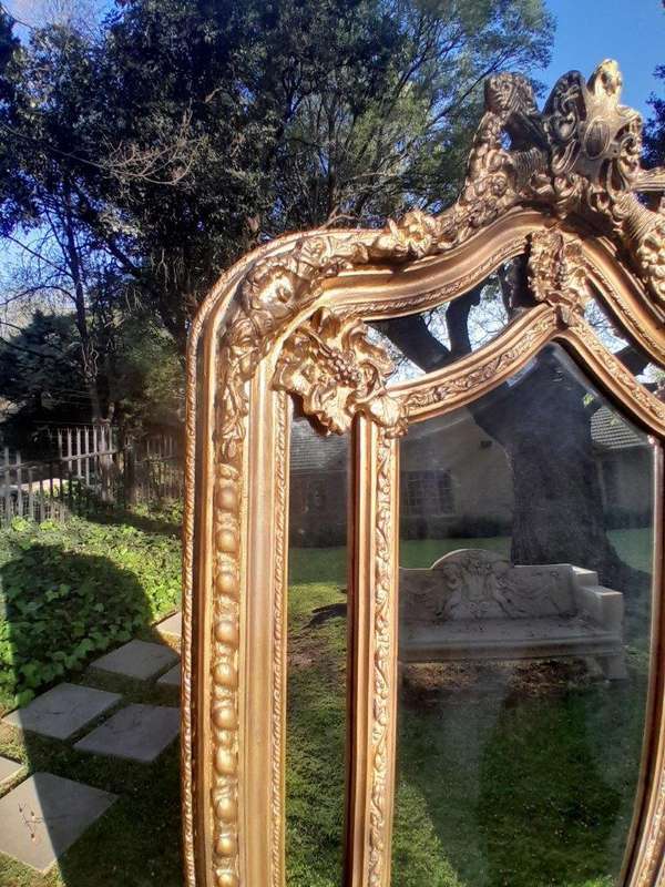 An Ornate Carved Rococo French Style Bevelled Mirror
