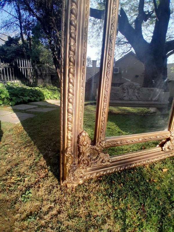 An Ornate Carved Rococo French Style Bevelled Mirror