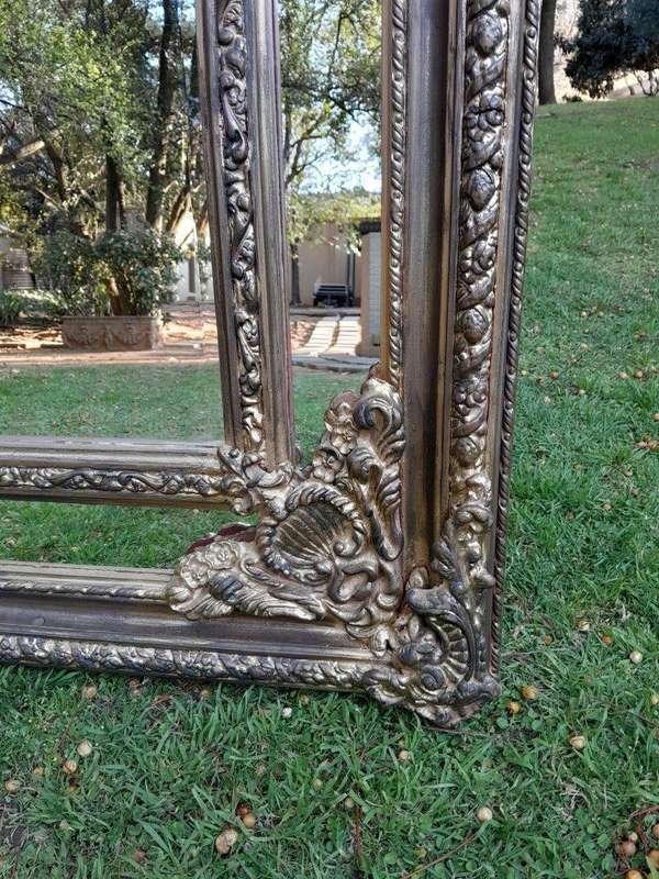 An Ornate Carved Rococo French Style Bevelled Mirror