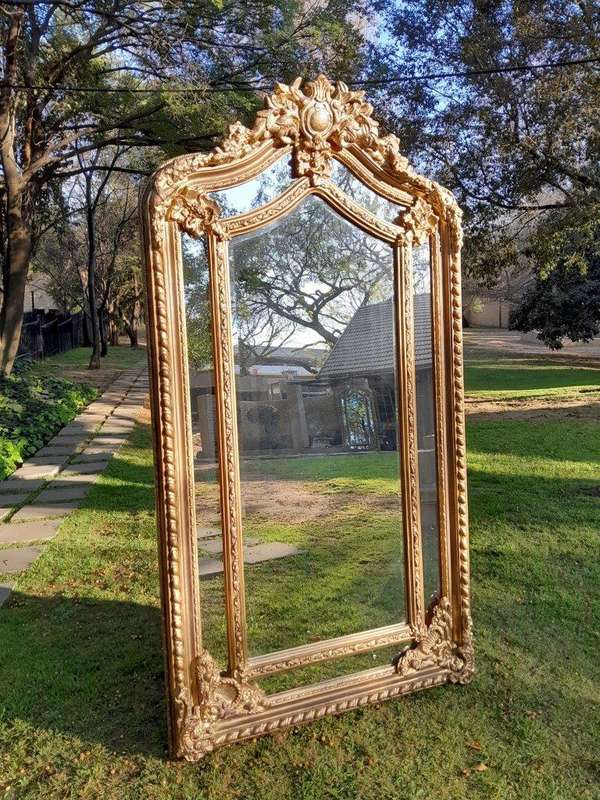 An Ornate Carved Rococo French Style Bevelled Mirror