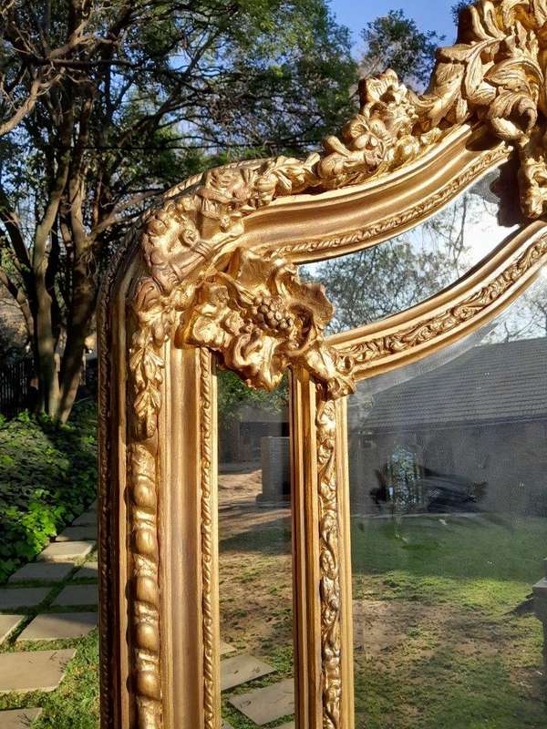 An Ornate Carved Rococo French Style Bevelled Mirror