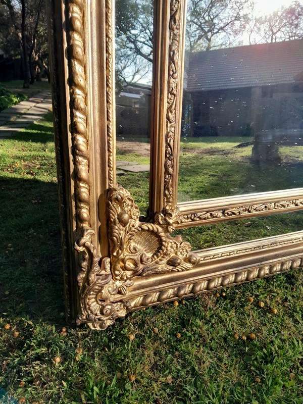 An Ornate Carved Rococo French Style Bevelled Mirror