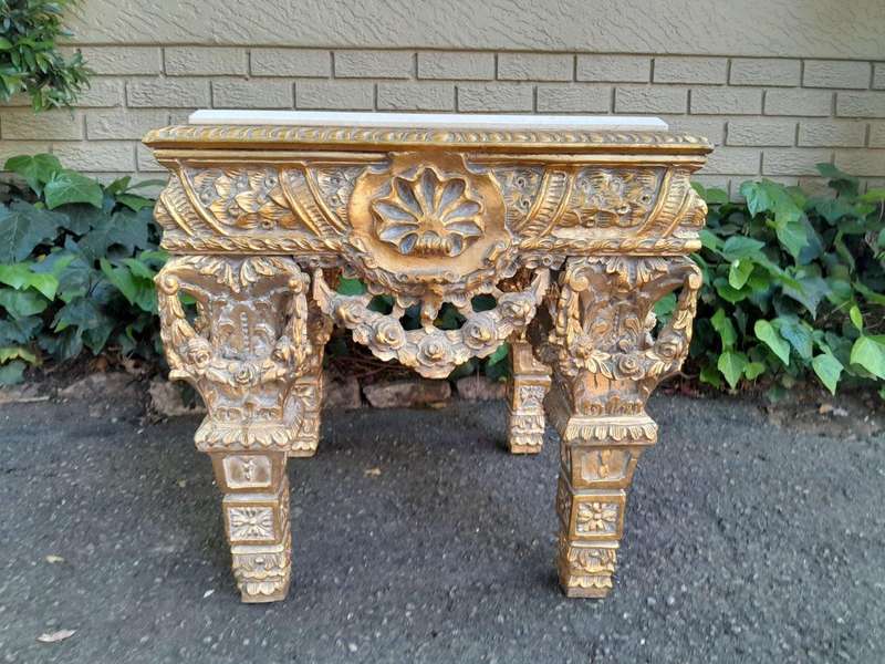A 20th Century French Style Ornately Carved Side Table with Marble Top