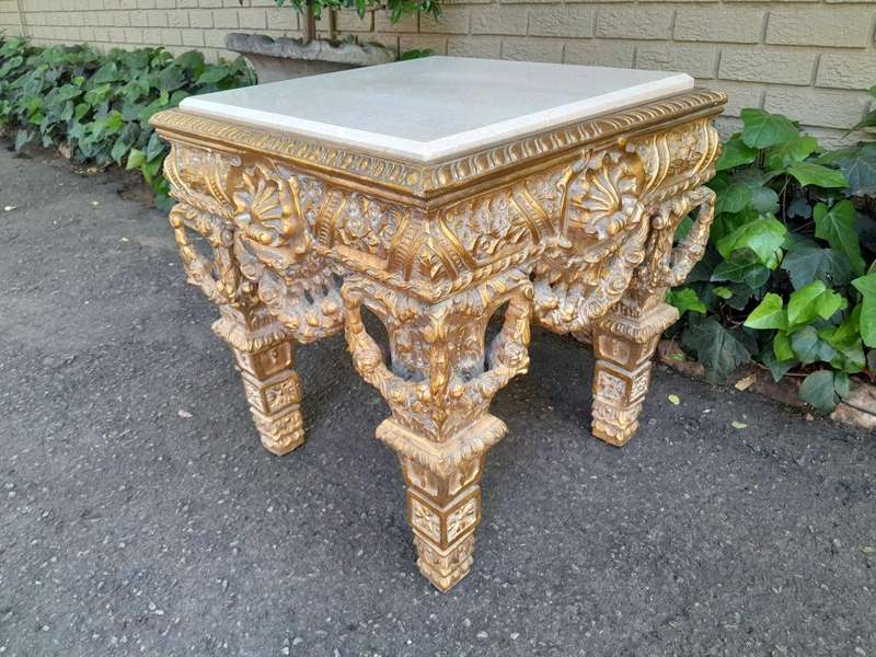 A 20th Century French Style Ornately Carved Side Table with Marble Top