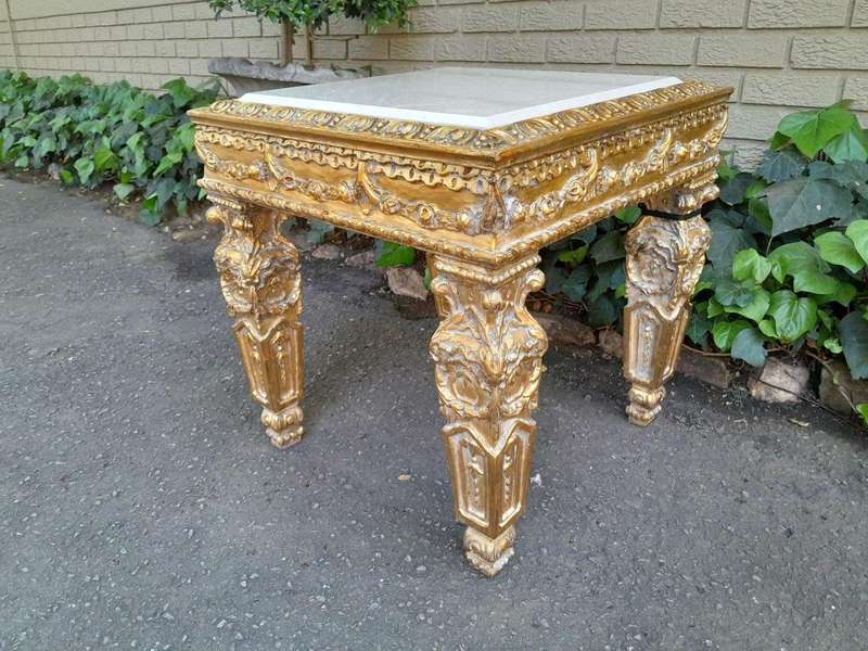A 20th Century French Style Ornately Carved Side Table with Marble Top