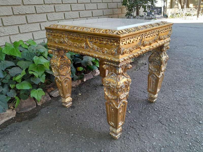 A 20th Century French Style Ornately Carved Side Table with Marble Top