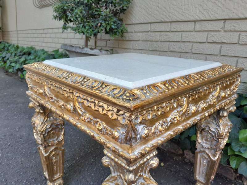 A 20th Century French Style Ornately Carved Side Table with Marble Top