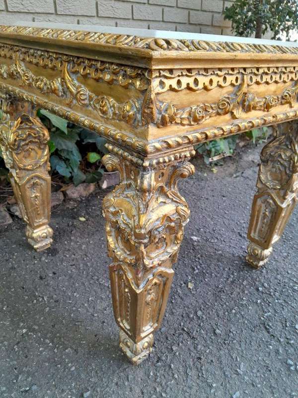 A 20th Century French Style Ornately Carved Side Table with Marble Top