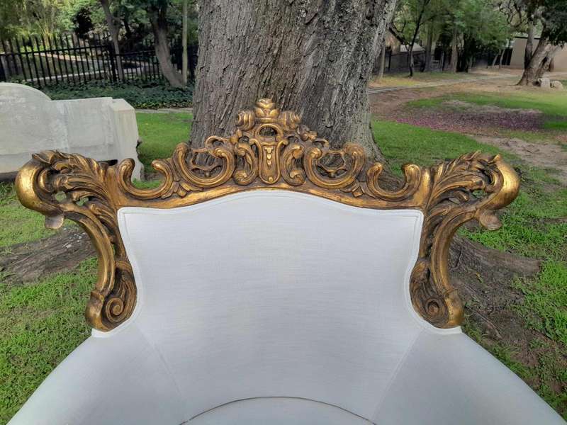 A French Style Pair of Ornately Carved Gilt Wood Armchairs