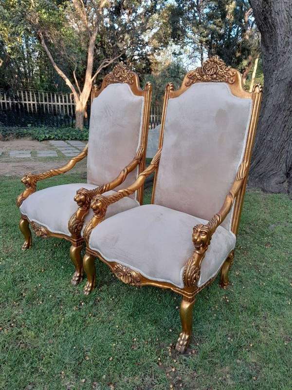 An Exceptional Pair of 20th Century French Style Ornately Carved & Giltwood Throne Chairs