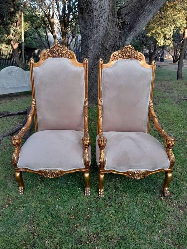 An Exceptional Pair of 20th Century French Style Ornately Carved & Giltwood Throne Chairs