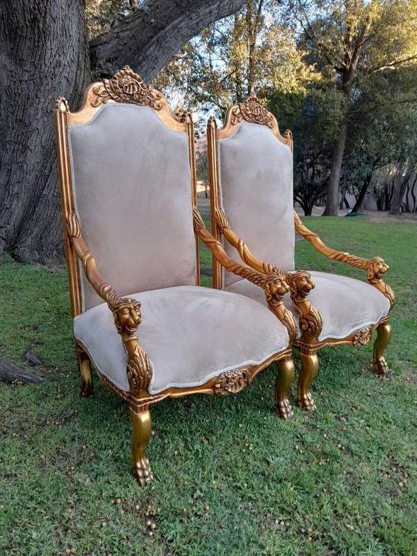 An Exceptional Pair of 20th Century French Style Ornately Carved & Giltwood Throne Chairs