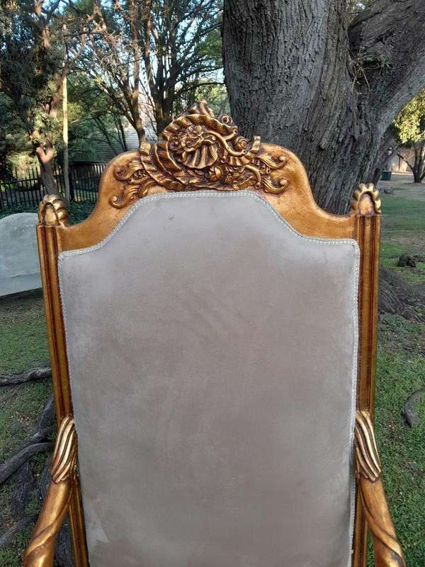 An Exceptional Pair of 20th Century French Style Ornately Carved & Giltwood Throne Chairs
