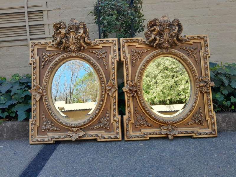 An Exceptional Pair of 20th Century French Style Ornately Carved and Gilded Bevelled Mirrors with...