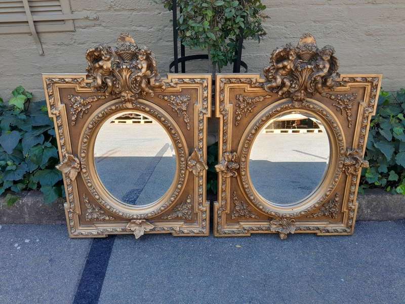 An Exceptional Pair of 20th Century French Style Ornately Carved and Gilded Bevelled Mirrors with...