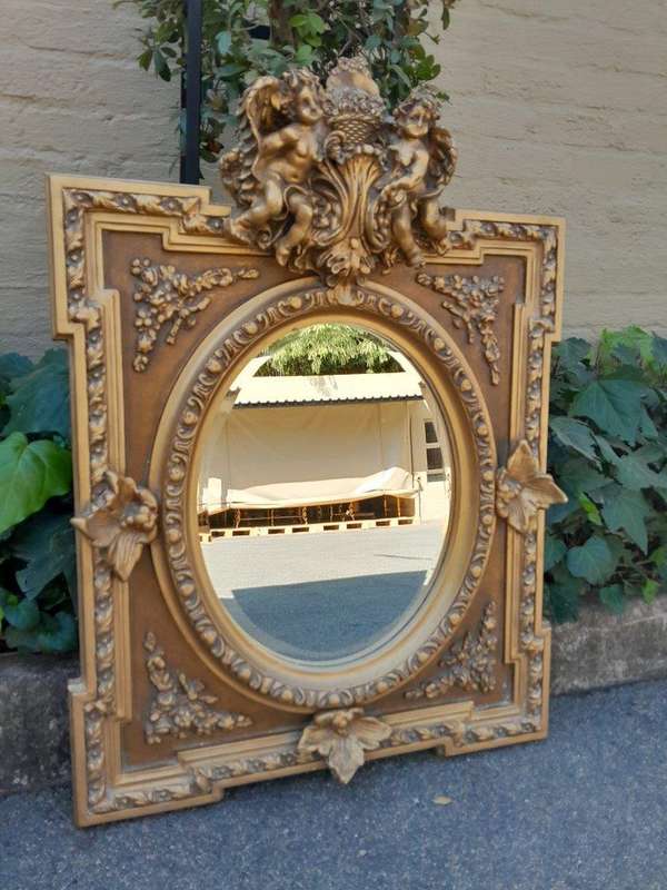 An Exceptional Pair of 20th Century French Style Ornately Carved and Gilded Bevelled Mirrors with...