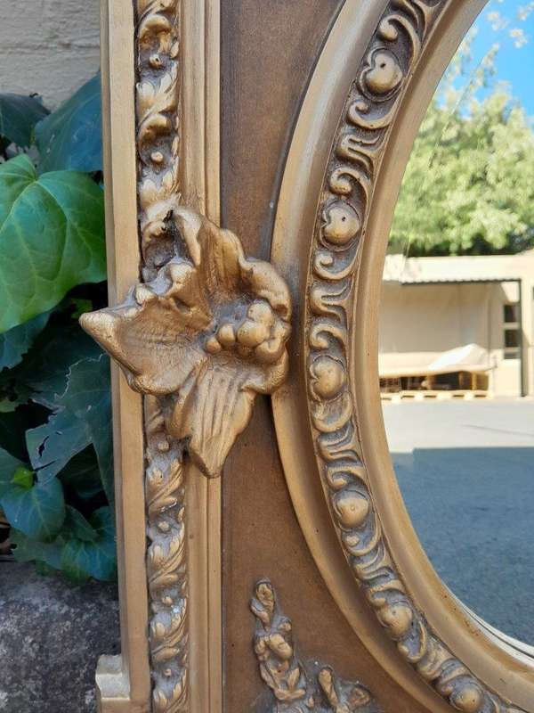 An Exceptional Pair of 20th Century French Style Ornately Carved and Gilded Bevelled Mirrors with...