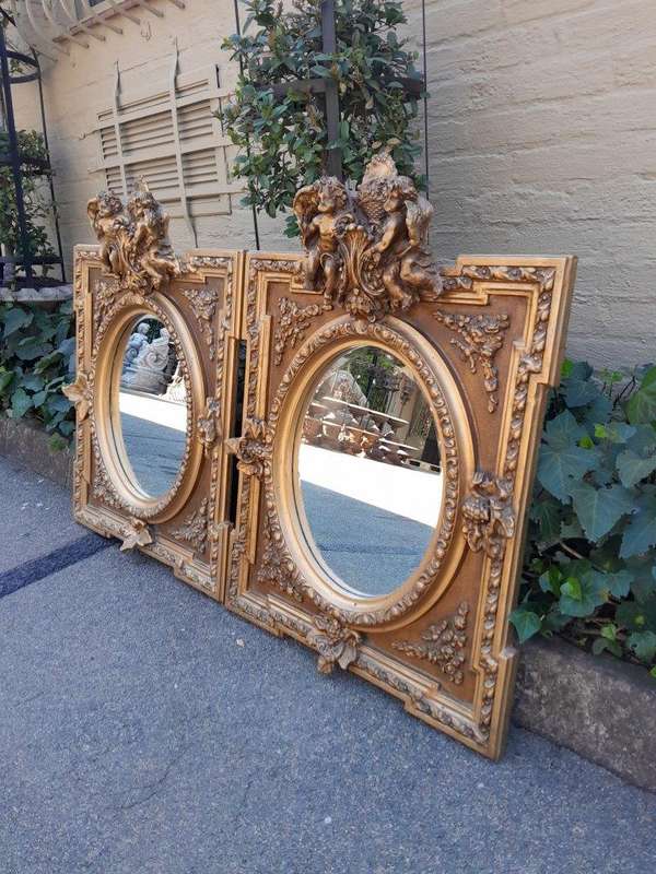 An Exceptional Pair of 20th Century French Style Ornately Carved and Gilded Bevelled Mirrors with...