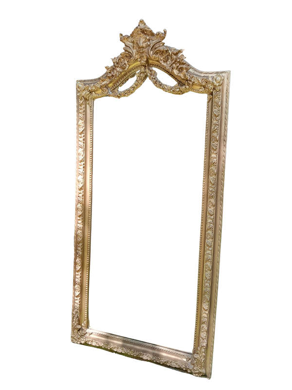 A French Rococo Style Ornately Carved and Gilded Bevelled Mirror