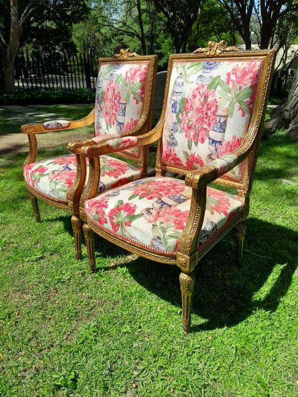 A Pair of 20th Century French Louis XVI Styled Ornately Carved and Gilded Fautelli Chairs