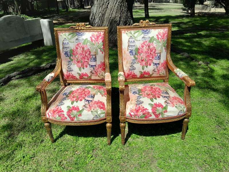 A Pair of 20th Century French Louis XVI Styled Ornately Carved and Gilded Fautelli Chairs