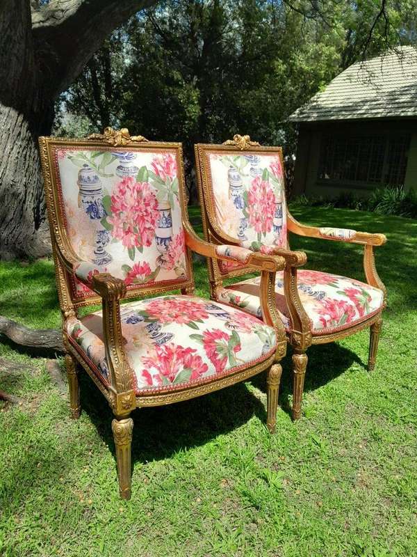 A Pair of 20th Century French Louis XVI Styled Ornately Carved and Gilded Fautelli Chairs