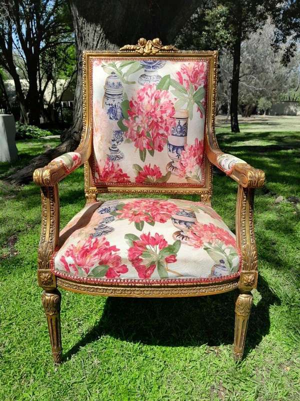 A Pair of 20th Century French Louis XVI Styled Ornately Carved and Gilded Fautelli Chairs