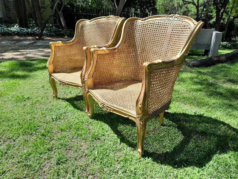 A 20th Century Pair of French Style Rattan Hand Gilded Wing Back Chairs