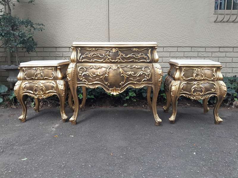 A Set of French Rococo Style Ornately Carved and Gilded Chest of Drawers and Pair of Side Tables ...
