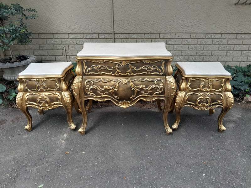 A Set of French Rococo Style Ornately Carved and Gilded Chest of Drawers and Pair of Side Tables ...